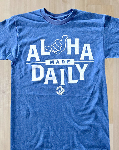 aloha made daily with shaka sign on heather blue tee